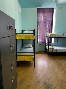 Voodi või voodid majutusasutuse Olympic Hostel toas
