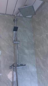 a shower in the corner of a room at Single Room XXX Manchester in Middleton