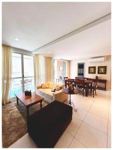 a living room with a couch and a table at Palm Beach 206 BL 4 by Holiday Stays in Aquiraz