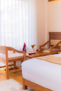 Ένα ή περισσότερα κρεβάτια σε δωμάτιο στο Temple Himalaya Hotel & Spa