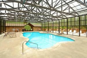 a large swimming pool in a large building at Pitch Perfect in Sevierville