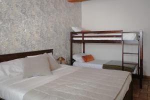 a bedroom with two bunk beds and a ladder at Locanda La Motta in Motta Baluffi