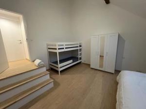 Postel nebo postele na pokoji v ubytování Gîte chez Naisse