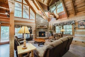 a living room filled with furniture and a fireplace at Big Kahuna Lodge cabin in Sevierville