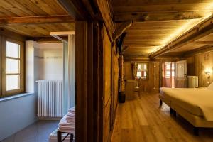 Postel nebo postele na pokoji v ubytování Mirtillo Alpino Casa Vacanze