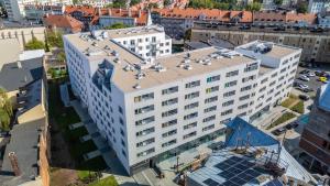 an overhead view of a large white building at Apartamenty Balijskie in Gliwice