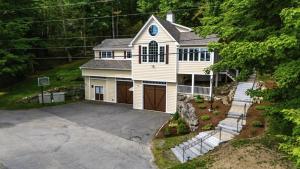 an aerial view of a house with a driveway at Stoneybrook Retreat Haven - The Carriage House in State Landing