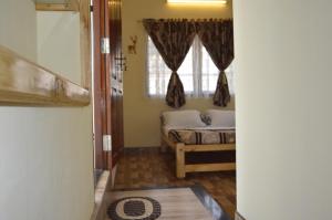 Postel nebo postele na pokoji v ubytování Aldos Ark Home Stay