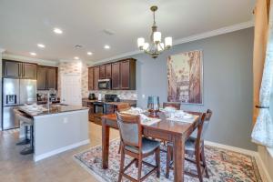 a kitchen with a dining room table and chairs at WFH, Relax and Enjoy At-Home Comforts in Orlando in Kissimmee