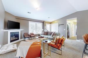 a living room with a couch and a fireplace at Northern Light Condominiums: Jack's Perch in Douglas
