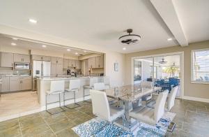 a kitchen and dining room with a table and chairs at Boat Dock and Pool Bayfront Crystal River Home in Crystal River