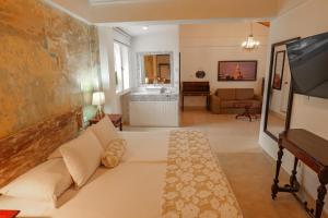 Postel nebo postele na pokoji v ubytování Hotel Kartaxa
