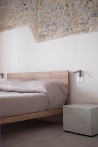 Postel nebo postele na pokoji v ubytování La Corte degli Archi