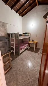 a room with two bunk beds and a table at Apto. en zona céntrica con vista panorámica al pueblo in San Gil