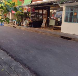 an empty street in front of a store at 362 สวนอ้อย5 in Dusit