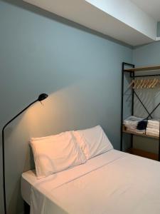 Una cama o camas en una habitación de Studio Moderno no centro de São Paulo