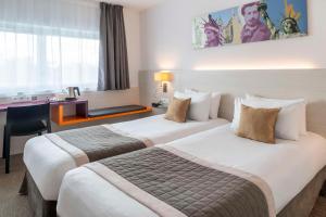 Postel nebo postele na pokoji v ubytování Best Western Colmar Expo