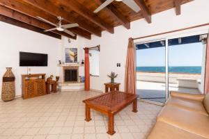 a living room with a view of the ocean at La Gaviota in Puerto Peñasco