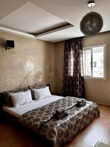 Postel nebo postele na pokoji v ubytování Luxueuse villa à Moulay Bouselham