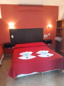 Postel nebo postele na pokoji v ubytování Apart Hotel Nonquen