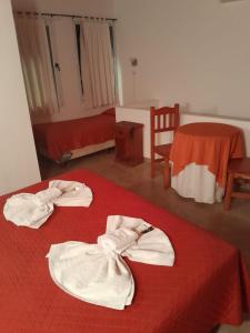 Postel nebo postele na pokoji v ubytování Apart Hotel Nonquen