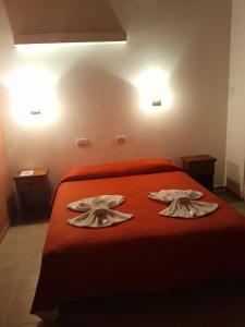 Postel nebo postele na pokoji v ubytování Apart Hotel Nonquen