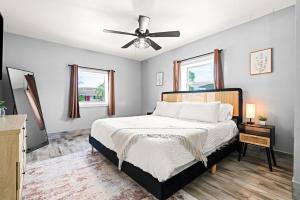 a bedroom with a bed and a ceiling fan at October Special! Limited-time Discount Book Now! in Jupiter +47 photos
