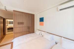 Ένα ή περισσότερα κρεβάτια σε δωμάτιο στο Flower Base HIMAWARI