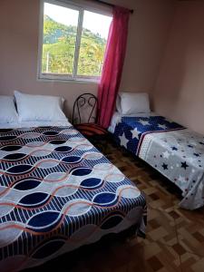 Voodi või voodid majutusasutuse Magnof toas