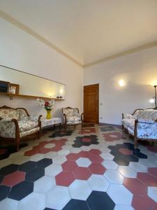 a room with couches and a floor with at Centro Storico Portoferraio in Portoferraio