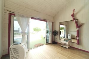a living room with a large sliding glass door at El Embrujo Tintipan in Tintipan Island