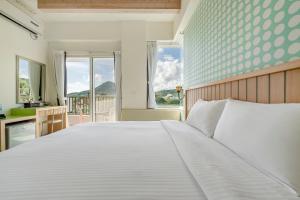 Voodi või voodid majutusasutuse Green Beauty Homestay toas