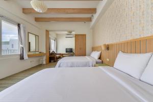 Voodi või voodid majutusasutuse Green Beauty Homestay toas