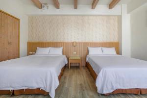 Voodi või voodid majutusasutuse Green Beauty Homestay toas