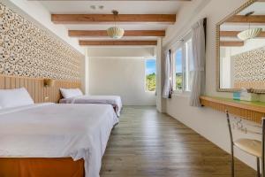 Voodi või voodid majutusasutuse Green Beauty Homestay toas