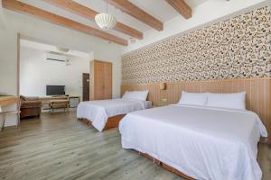 Voodi või voodid majutusasutuse Green Beauty Homestay toas