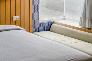Voodi või voodid majutusasutuse Green Beauty Homestay toas