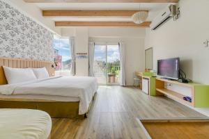Televiisor ja/või meelelahutuskeskus majutusasutuses Green Beauty Homestay