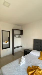 Postel nebo postele na pokoji v ubytování Hotel Linaje Popayán