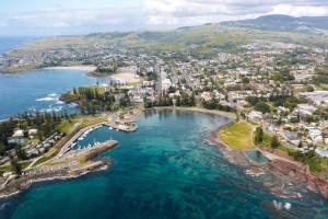 an aerial view of a city and the ocean at The Sebel Kiama in Kiama +16 photos