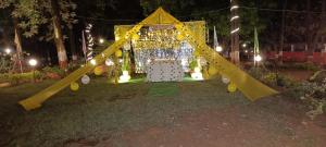 a playground with a slide in a park at night at Satpura Adventure resort' in Pachmarhī