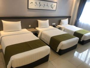 En eller flere senge i et værelse på Savanna Hill Resort