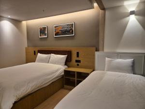 Postel nebo postele na pokoji v ubytování The solid residence - Elbon the stay by haeundae