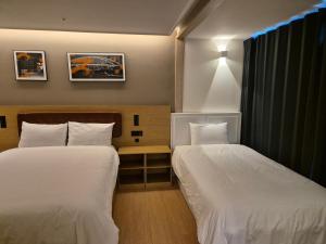 Postel nebo postele na pokoji v ubytování The solid residence - Elbon the stay by haeundae