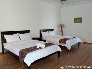 Katil atau katil-katil dalam bilik di Ream Yoho Hotel