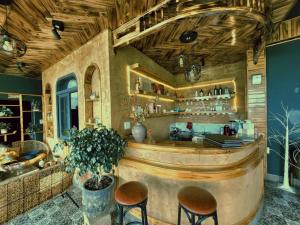 a bar in a restaurant with two stools at My Garden Villa in Sapa