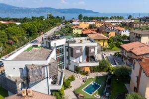 an aerial view of a house in a town at Rosy & Onyx House With Shared Pool in Toscolano Maderno