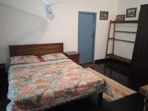 Postel nebo postele na pokoji v ubytování Cascade Cottage Kotmale