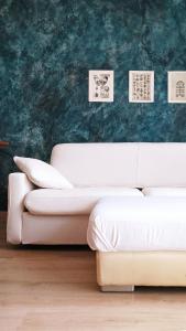 Ένα ή περισσότερα κρεβάτια σε δωμάτιο στο Bilocale con spazio esterno attrezzato