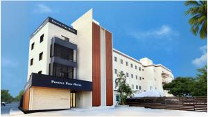 a building with a sign that reads premier bus inn at Phoenix Park Hotel in Nago